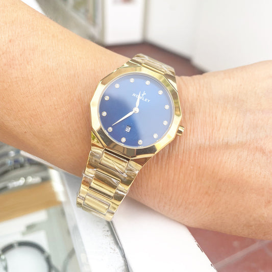 Reloj NOWLEY PRISMA dorado esfera azul con circonitas para mujer
