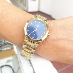 Reloj NOWLEY PRISMA dorado esfera azul con circonitas para mujer