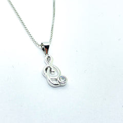 Collar de plata rodiada con colgante clave de sol con circonita para mujer