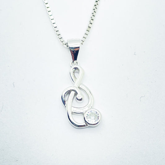 Collar de plata rodiada con colgante clave de sol con circonita para mujer