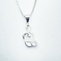 Collar de plata rodiada con colgante clave de sol con circonita para mujer