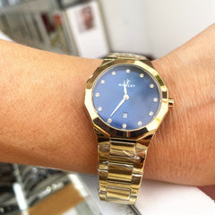 Reloj NOWLEY PRISMA dorado esfera azul con circonitas para mujer